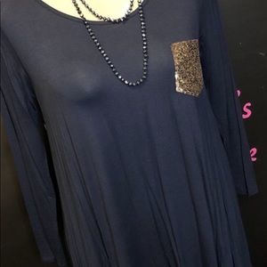 Long shirt with a sequin pocket